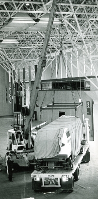 One of several "people movers" due to go on display in Currigan Hall Wednesday is shown as it was unloaded there by a big crane Monday. June 4, 1973. Photo by John Whitworth. (WH2129-2018-1308)