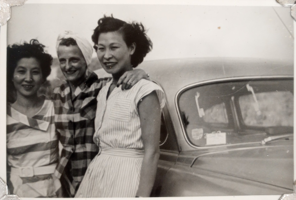Kimiko Side (right) with two friends leaning against a car, circa 1940s. Kimiko Side Papers, WH2528, OVBx6