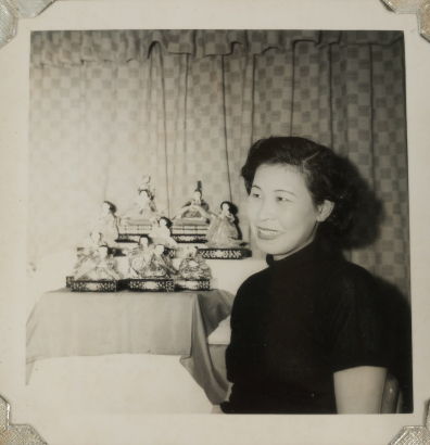 Kimiko Side posing with Kimekomi dolls she crafted, circa 1960s. Kimiko Side Papers, WH2528, OVBx6