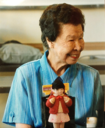 Kimiko Side with a Kimekomi doll, circa 2010s. Kimiko Side Papers, WH2528, PhBx12