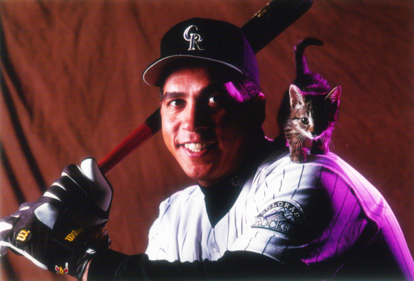 Rockies first baseman, Andres Galarraga with cat on shoulder