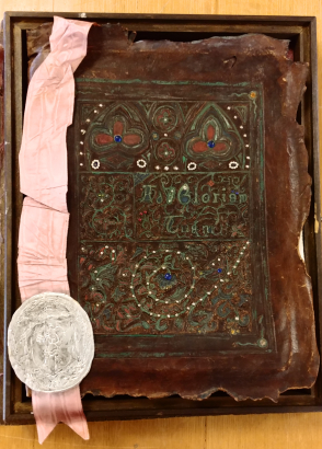Ornamented cover and cloth bookmark, nestled in box