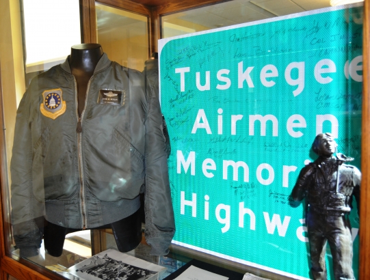 John Mosely’s Flight Jacket & Highway Sign
