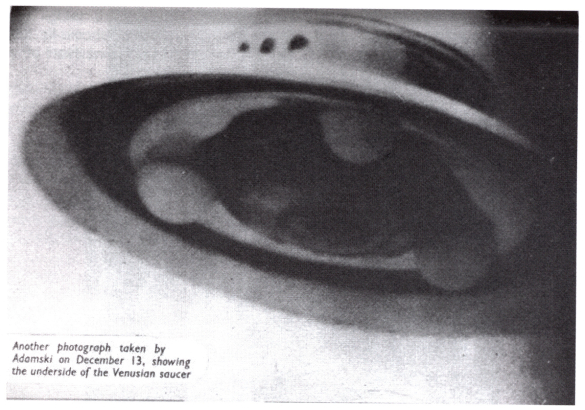 Photo is likely the most famous “UFO” photo Adamski took. It is actually the heating element from an egg brooder, complete with incandescent lightbulbs.