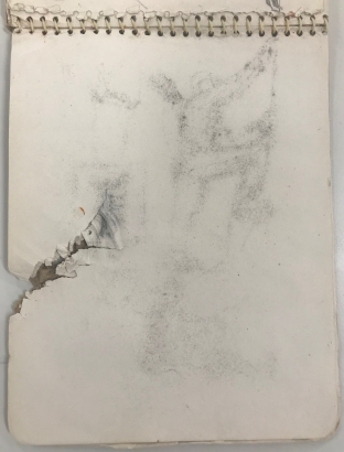 Sketchbook with shrapnel damage