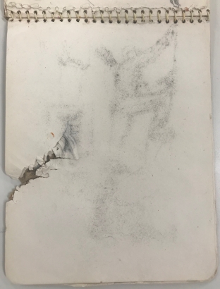 Sketchbook with shrapnel damage
