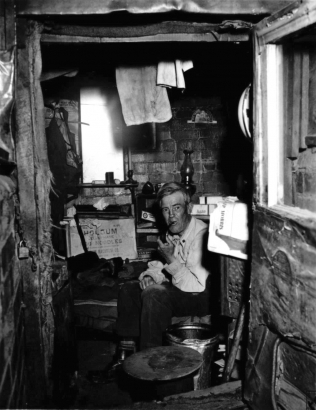 "Ben Lawton has lived in Gopher City since last fall. He makes a living tending lawns on Capitol Hill, but once The Cheyenne Leader published a 'lousy' poem he wrote." From the WHG Undigitized Photo files (Denver. Slums. Gopher City).