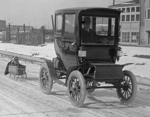 Electric car pulling a kid's sled
