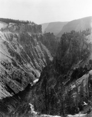 Grand Canyon of Yellowstone National Park, Wyoming, shows fast moving water deep in the riverbed carved in the volcanic rock of canyon walls.