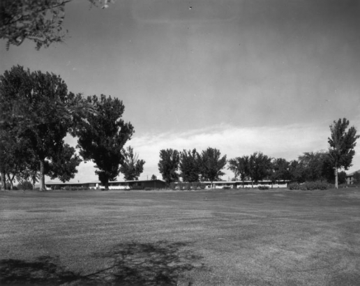 View of Colorado State Home and Training School (also known as Ridge Home), an institution for the mentally handicapped, in Ridge, Jefferson County, Colorado; shows dormitories and lawn.