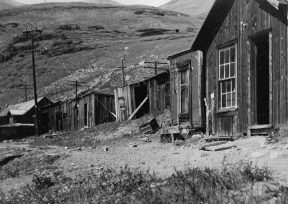 View of Waldorf, Clear Creek County, Colorado; shows buildings including (l to r): power house, stable, Post Office, and cables of the bucket line from Santiago to Waldorf.