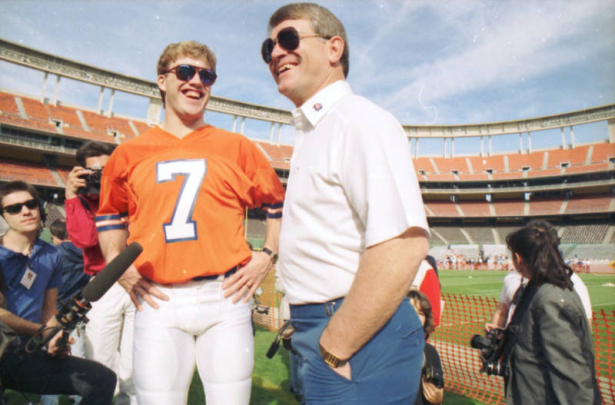 (SAN DIEGO, CA., January 26, 1988) Broncos quarterback John Elway laughs with head coach Dan Reeves as reporters ask questions at Jack Murphy Stadium in San Deigo during Press Day January 26, 1988, before Super Bowl XXll against the Redskins. (ROCKY MO...