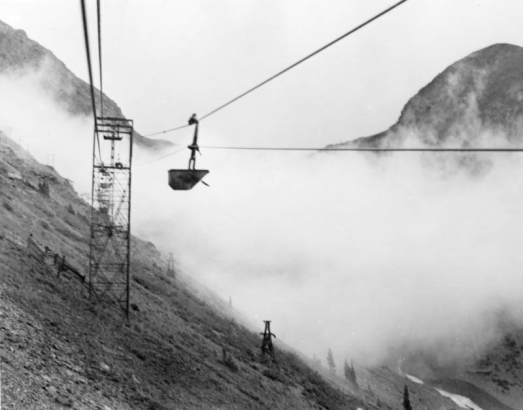 View, from an ore bucket on an aerial tramway, of the cloud covered Shenandoah-Dives Mine near Silverton (San Juan County), Colorado.