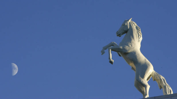 (BG902) The moon peers through the blue sky over Invesco Field at Mile High as the Denver Broncos lose to the Indianapolis Colts 34-31 in the fourth quarter at on Sunday, Oct. 29, 2006. Broncos lose 34-31. (BARRY GUTIERREZ/ROCKY MOUNTAIN NEWS) *** NAME...