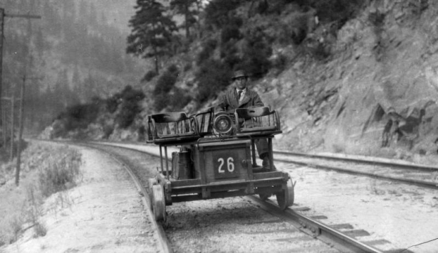 E. B. Allison operates Western Pacific track inspection motor car No. 26, in Feather River Canyon, California.
