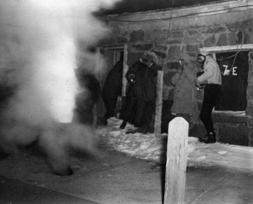 Members of the AdAmAn Club stand back as fireworks blast from a pipe tube, outside the Cog Railway Terminal building, Pikes Peak, Colorado Springs, El Paso County, Colorado.