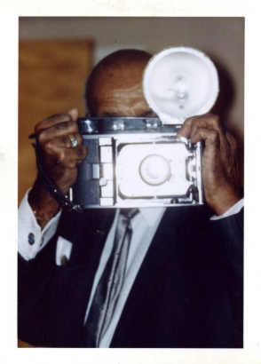 Dr. Clarence Holmes with camera