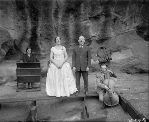 Men and women sing, play a portable piano and cello at the Garden of Angels (Red Rocks Amphitheater) near Morrison (Jefferson County), Colorado.