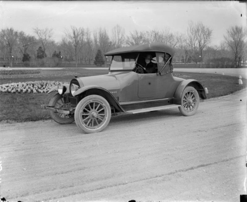 Mrs. Sade Rhoads sits in a 1918 Kissel two passenger sedan in a Denver, Colorado park.