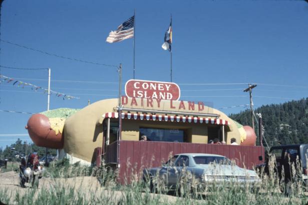 View of Coney Island hot dog stand located at 10 Old Stagecoach Road, Bailey, Colo.  Built by Lloyd Williams and Marcus R. Shannon in 1966, the unique diner, shaped as a 42-foot hot dog in a 34-foot bun, was originally located on Colfax Avenue in Denver, Colo.  Since then it has resided in Conifer and can now be found in Bailey, Colo.