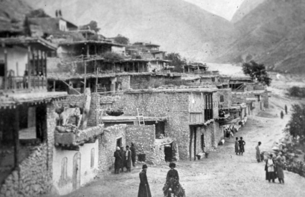 Photomechanical reproduction of a photograph by George Kennan shows multi-story buildings in Gimry, in the Untsukulsky District of the Republic of Dagestan, in Russia.