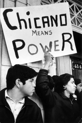 Young Mexican-American men protest the arrest of Mexican Americans for a bus bombing in Denver, Colorado. They hold a sign that reads: "Chicano Means Power."