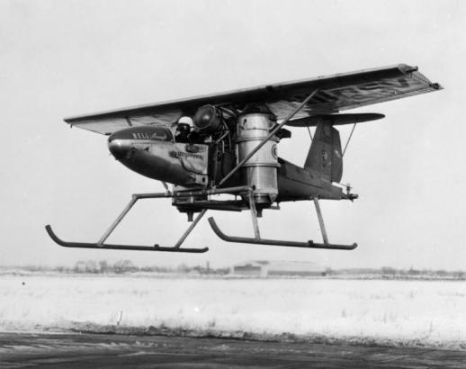 View of a Bell Aircraft jet propelled vertical rising airplane in flight at Niagara Falls (Niagara County) New York; letters read: "Experimental," and "NIIO5V."