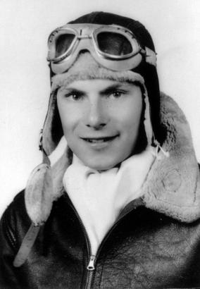 Portrait of Charles A. "Chick" Stevens, pilot, aviation journalist, and one time editor of Frontier Magazine, at Primary Flying School, Pine Bluff (Jefferson County) Arkansas. He wears flight goggles, cap, and jacket.