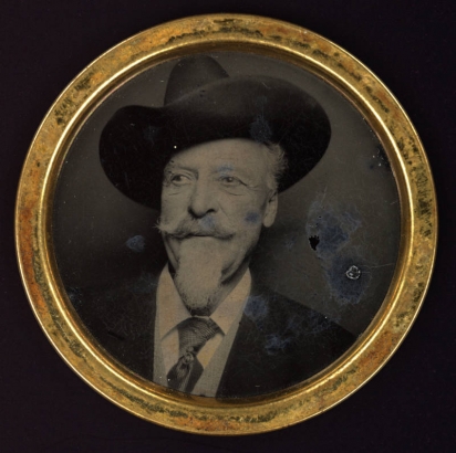 Studio portrait of William F. Cody (Buffalo Bill). He wears a cowboy hat.