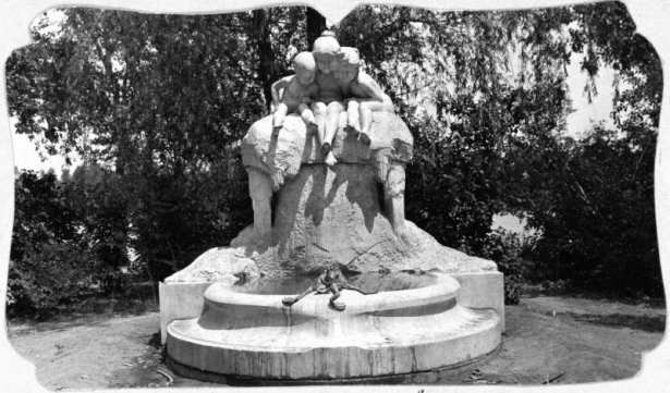 Shows the Children's Fountain located in City Park in Denver, Colorado. The marble statue and fountain was built by Max Blondet, a Prussian sculptor, in 1912. He copied the design from the original sculpture in Dusseldorf, Germany done by Henry C. Charpeot.