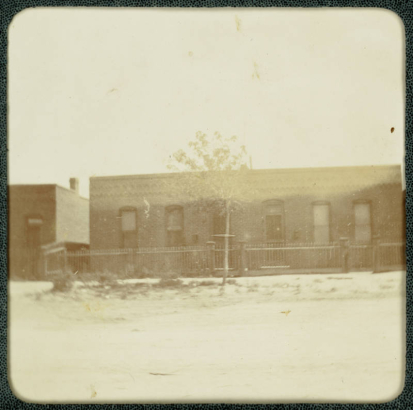 View of a brick duplex home in Denver, Colorado.