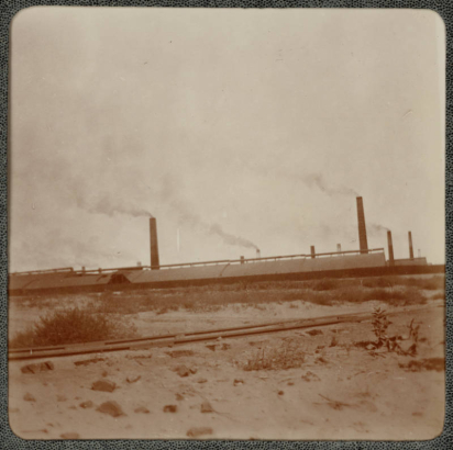 View of the buildings and smokestacks of the Denver Engineering Works Company at 30th (Thirtieth) and Blake Streets in Denver, Colorado.