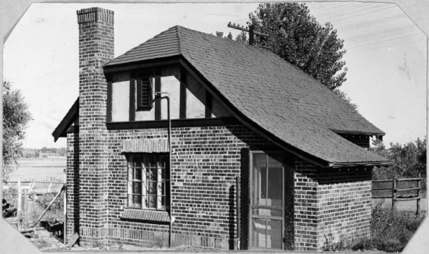 View of a brick building at the north gate to the Wellshire Golf Course (Wellshire Country Club) in Denver, Colorado.