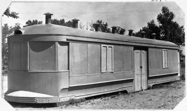 View of the puppet theater and woodworking shop at Rude Park Community Center at 1285 Decatur Street in Denver, Colorado. The building is a renovated railroad car.