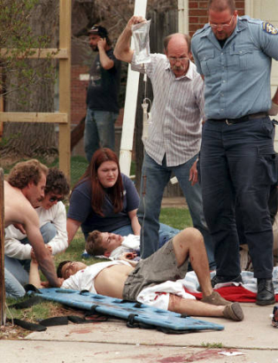 Emergency workers treat wounded students during the Columbine shooting.