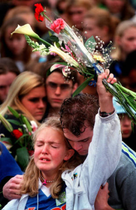 Dale Napoletano hugs his sister during a memorial service honoring Columbine's victims.