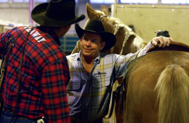 (Denver, Colo., 1/19/05- David Motes (right) talks with his partner Zane David Bruce their competition in the team roping event at the Wednesday Matinee Rodeo,  January 19, 2005 at the National Western Stock Show and Rodeo. At 51, Motes is the oldest c...