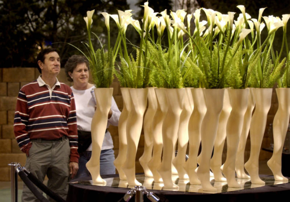(Denver,  COLO. JANUARY 24, 2005)   Tony Kaempfer (cq Kaempfer), 60, and Barb Slaten (cq Slaten), also 60, and both from Centennial, admires an exhibit made with mannequin legs and flowers, created by Bouquets, a floral store in Denver, Lakewood, and B...