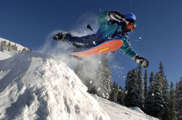 (11/30/2004) David Parks, 12, on vacation from Oklahoma, flies over a snow ramp while sledding the top of Berthoud Pass on Monday, November 30, 2004. The state just released its latest figures on this year's snow pack percentages. Photo by TODD HEISLER...