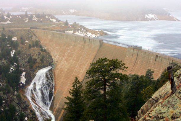 Water flows out of the mid point valve of Gross Dam from Gross Reservoir to South Boulder Creek Thursday March 15, 2007. Gross Reservoir is part of the Denver Water system, provoiding drinking water to Denver. The weather and rate of thaw will play a b...