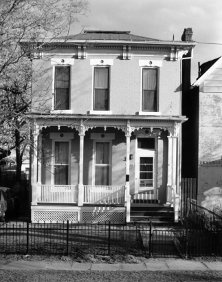 View of a house at 2752 Champa Street in the Five Points neighborhood of Denver, Colorado. The two-story house has a covered porch.