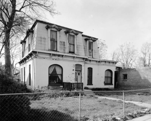 View of a house at 2445 California Street in the Five Points neighborhood of Denver, Colorado. The two-story house has decorative eaves.