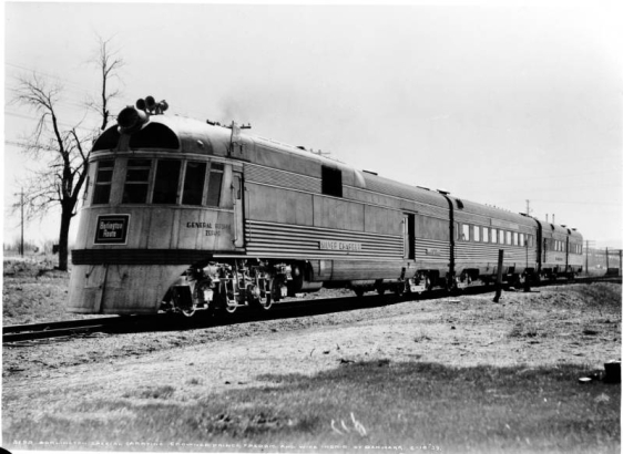 Burlington Zephyr "Silver Charger" carrying Prince Fredric and wife Ingrid of Denmark; shows a high speed silver streamliner of the Burlington Route (Chicago, Burlington & Quincy) with three car bodies mounted on four trucks; "General Pershing Zephyr."