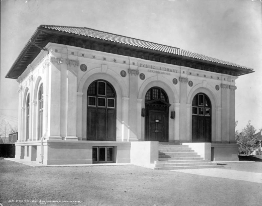 Exterior of Dickinson Branch, named for Charles E. Dickinson, a banker, (West Denver Branch) of Denver Public Library, southwest corner of Hooker and West Conejos Place, Denver, Colorado; 1914 Italian cottage design features a tile roof, decorative arches, pilasters, and busts, by Dudley S. Carpenter, of American authors.