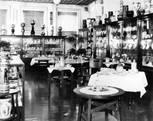 Interior view of the Daniels and Fisher store in Denver, Colorado; shows displays of China, cut crystal, end tables, porcelain lamps.