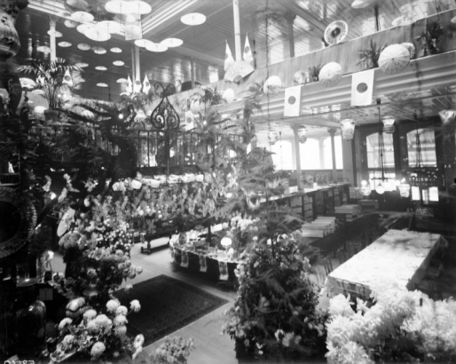 Interior view of the Daniels and Fisher store in Denver, Colorado; shows chrysanthemums, paper umbrellas, and Japanese flags.
