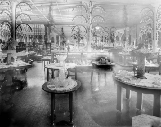 Interior view of the Daniels and Fisher store in Denver, Colorado; shows displays of crystal, glass, and lamps.