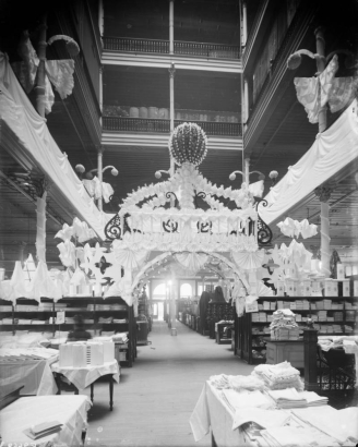 Interior view of the Daniels and Fisher store in Denver, Colorado; shows a display of fabric in the form of a gazebo, and the mezzanine.