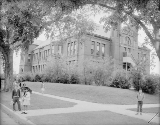 Manual Training High School in the Five Points neighborhood of Denver, Colorado.  Children walk on the sidewalks.