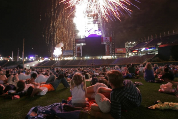 439 A family huddles together as thousands of Colorado Rockies fans watch fireworks from the field during the Fourth of July celebration after the Colorado Rockies beat the New York Mets at Coors Field Denver, Colo., Tuesday, July 3, 2007.  The firewor...